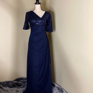 Blue embellished chiffon gown by Xscape.